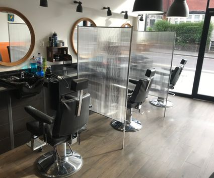 The bright interior of The Cut barbershop